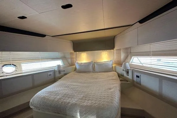  Yacht Photos Pics Luxurious bedroom interior of 2015 Azimut 80 yacht with elegant bedding and ambient lighting.