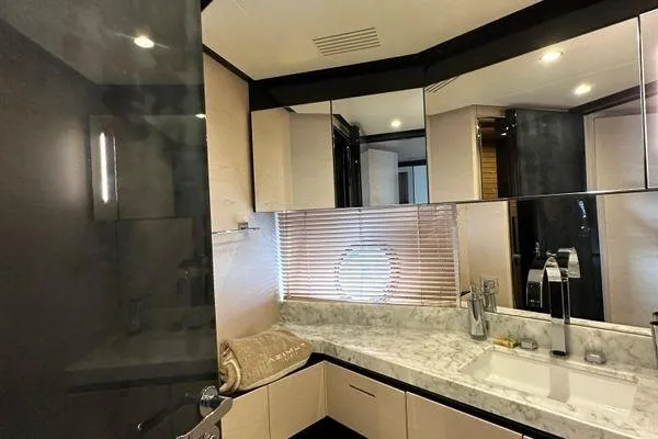  Yacht Photos Pics Luxurious bathroom interior of 2015 Azimut 80 yacht with marble countertop and modern fixtures.