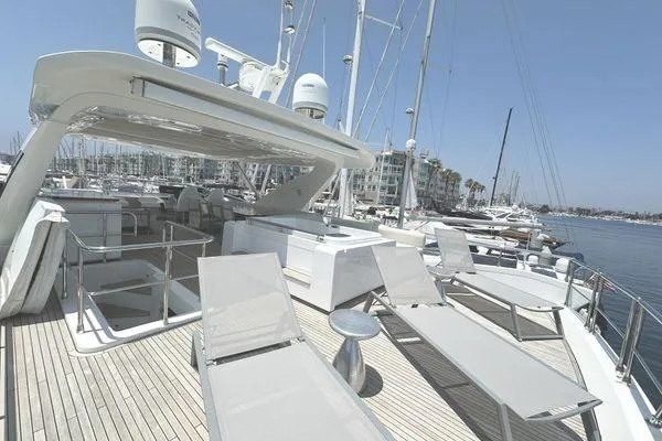  Yacht Photos Pics Luxurious 2015 Azimut 80 yacht deck with sun loungers, docked in a marina.