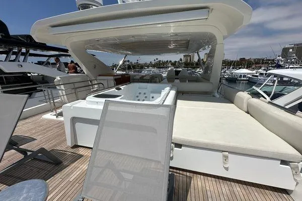  Yacht Photos Pics Luxurious 2015 Azimut 80 yacht deck with sun loungers and jacuzzi, docked at marina.