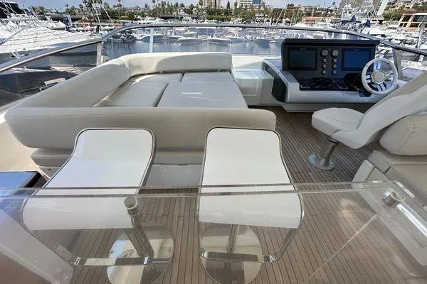  Yacht Photos Pics Luxurious 2015 Azimut 80 yacht deck with seating and helm, docked at marina.