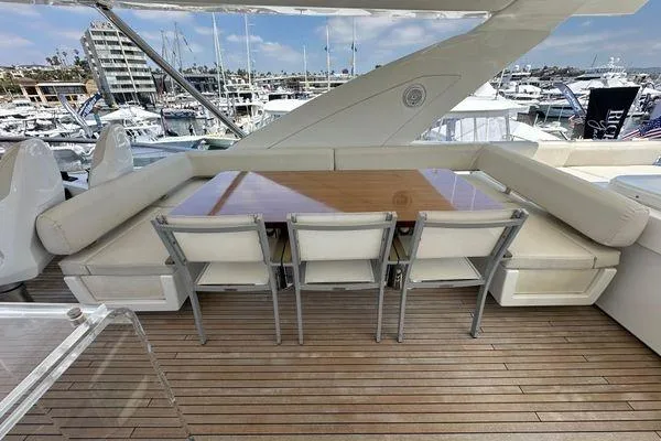  Yacht Photos Pics Luxurious 2015 Azimut 80 yacht deck with elegant seating and wooden table.