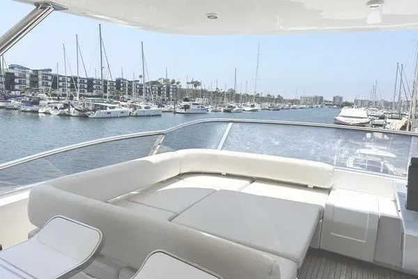  Yacht Photos Pics Luxurious 2015 Azimut 80 yacht with spacious deck, overlooking marina with sailboats.