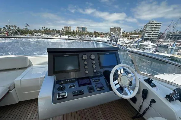  Yacht Photos Pics Control panel of a 2015 Azimut 80 yacht with marina view.