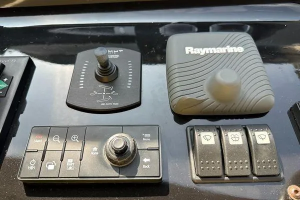  Yacht Photos Pics Control panel of a 2015 Azimut 80 yacht featuring Raymarine navigation equipment.