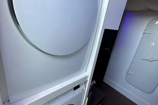  Yacht Photos Pics Laundry area inside 2015 Azimut 80 yacht, featuring modern appliances and sleek design.