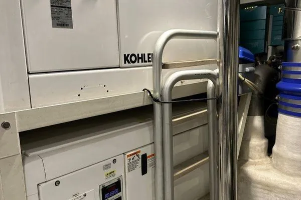  Yacht Photos Pics Engine room of 2015 Azimut 80 yacht featuring Kohler equipment and metal railings.