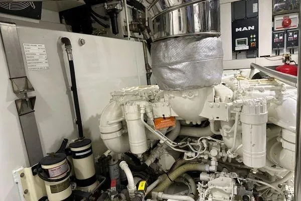  Yacht Photos Pics Engine room of a 2015 Azimut 80 yacht, featuring a MAN engine and various components.