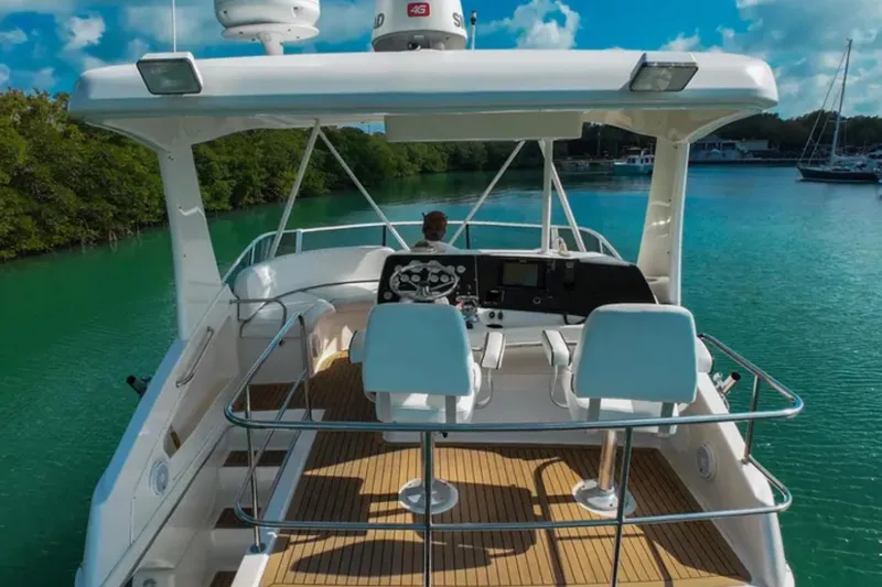  Yacht Photos Pics 2003 Silverton 42 Convertible yacht navigating serene turquoise waters.