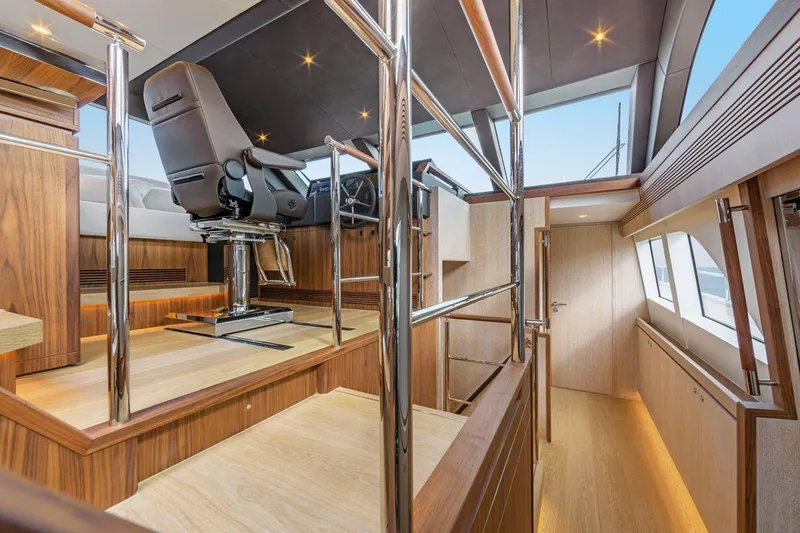  Yacht Photos Pics Luxurious interior of 2021 Van der Valk HELGA yacht with modern helm and wooden finishes.