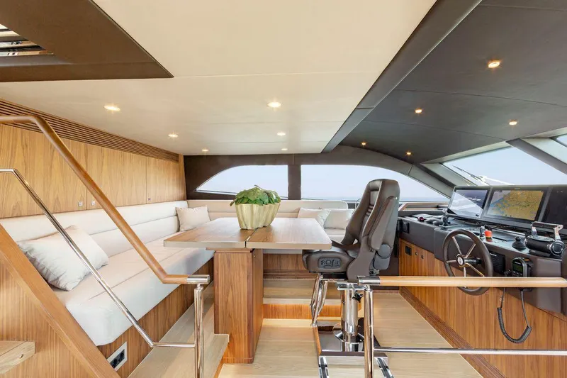  Yacht Photos Pics Luxurious interior of 2021 Van der Valk HELGA yacht with modern helm and seating area.