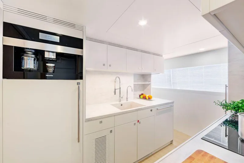  Yacht Photos Pics Modern yacht kitchen with sleek white cabinetry, built-in appliances, and natural light. Van der Valk HELGA 2021.