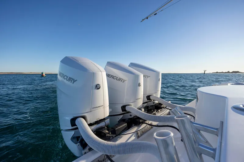  Yacht Photos Pics 2024 Onslow Bay 33 TE boat with triple Mercury outboard engines on open water.