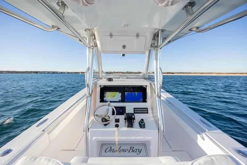  Yacht Photos Pics 2024 Onslow Bay 33 TE boat dashboard with navigation system on open water.