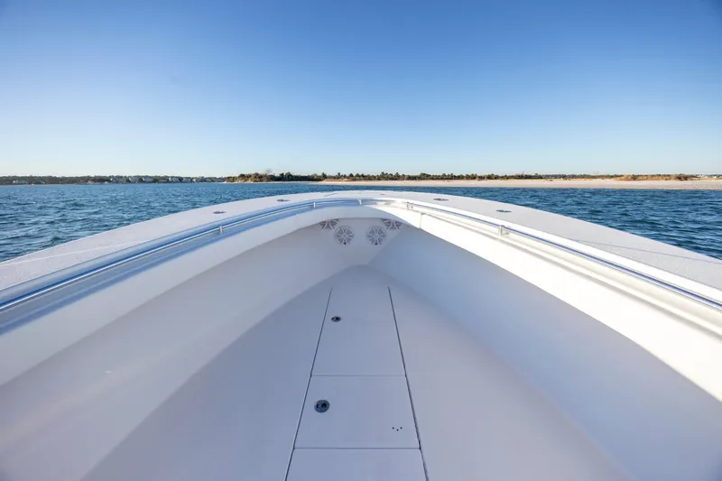  Yacht Photos Pics 2024 Onslow Bay 33 TE boat on calm water, clear sky background.
