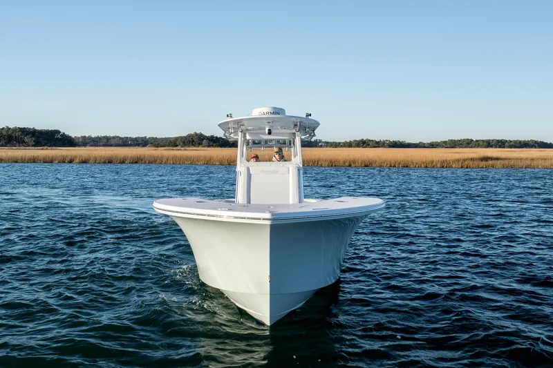  Yacht Photos Pics 2024 Onslow Bay 33 TE boat cruising on open water under clear blue sky.