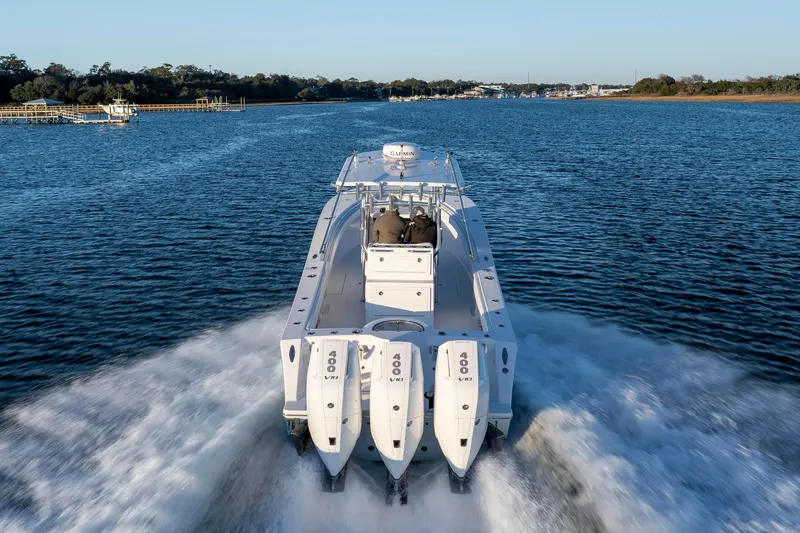  Yacht Photos Pics 2024 Onslow Bay 33 TE boat cruising on a scenic waterway.