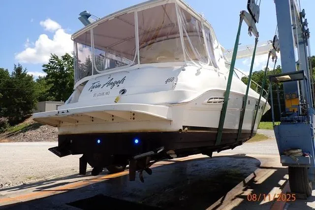  Yacht Photos Pics 2003 Sea Ray 460 Sundancer yacht on lift, rear view, sunny day.