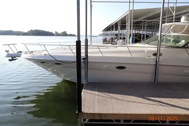  Yacht Photos Pics 2003 Sea Ray 460 Sundancer yacht docked at marina on a sunny day.