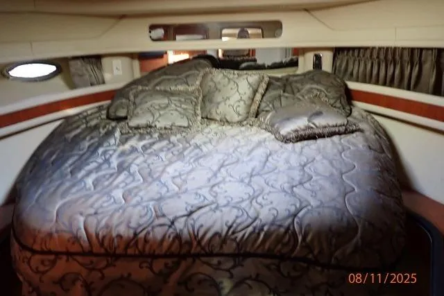  Yacht Photos Pics Luxurious bedroom interior of 2003 Sea Ray 460 Sundancer yacht with elegant bedding.