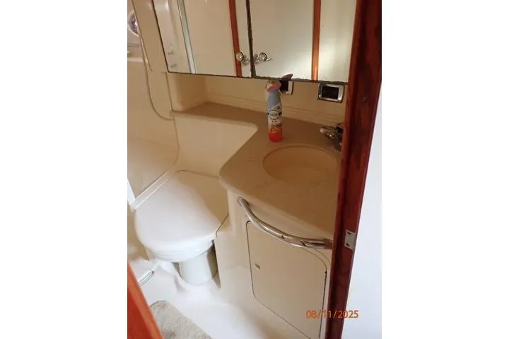  Yacht Photos Pics Bathroom interior of 2003 Sea Ray 460 Sundancer yacht, featuring sink and toilet.