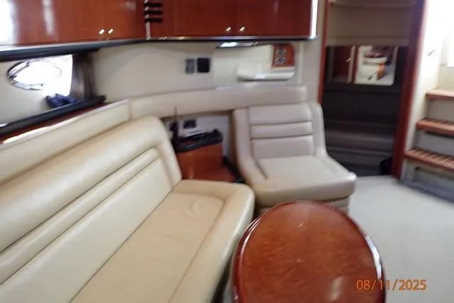  Yacht Photos Pics Interior of 2003 Sea Ray 460 Sundancer yacht with beige seating and wooden accents.