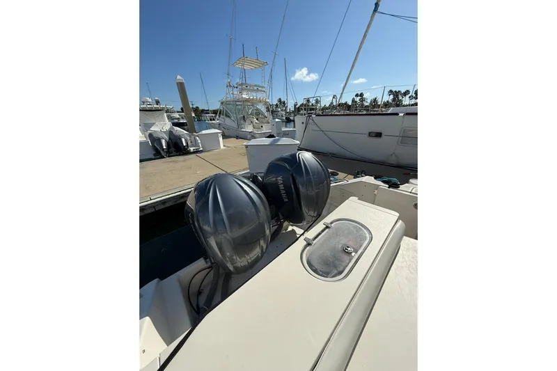  Yacht Photos Pics 2004 Pursuit 3370 Offshore boat with dual Yamaha engines docked at marina.