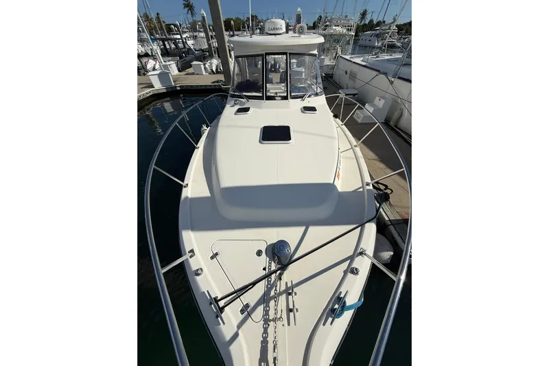  Yacht Photos Pics 2004 Pursuit 3370 Offshore boat docked at marina, top view.
