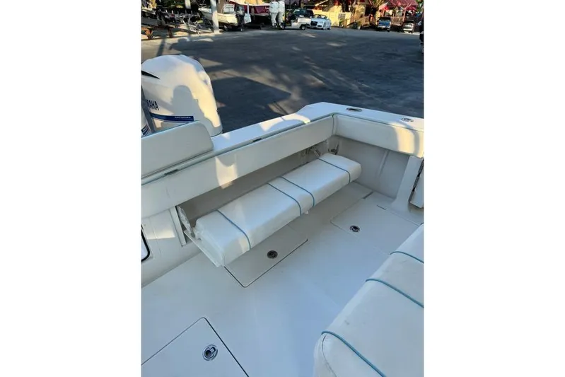  Yacht Photos Pics 2014 Jupiter 34 boat interior with white cushioned seating and Yamaha engine.