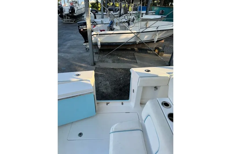  Yacht Photos Pics 2014 Jupiter 34 boat interior with seating and storage, docked near other boats.