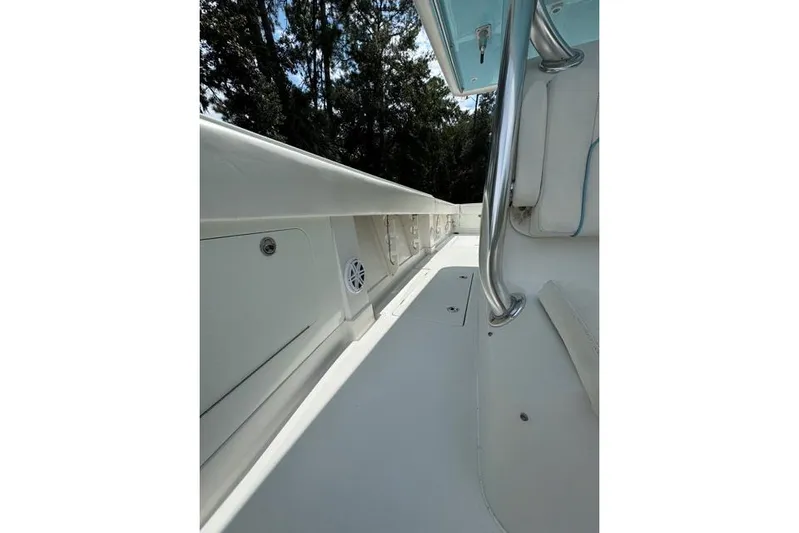  Yacht Photos Pics 2014 Jupiter 34 boat interior with sleek white deck and stainless steel railing.