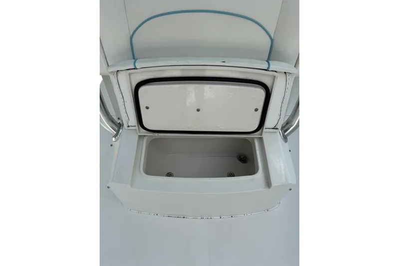  Yacht Photos Pics Open storage compartment on a 2014 Jupiter 34 boat, featuring a white interior.