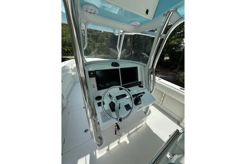  Yacht Photos Pics 2014 Jupiter 34 boat cockpit with steering wheel and dual screens.