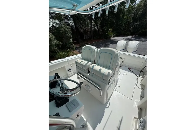  Yacht Photos Pics 2014 Jupiter 34 boat cockpit with dual seats and steering wheel.