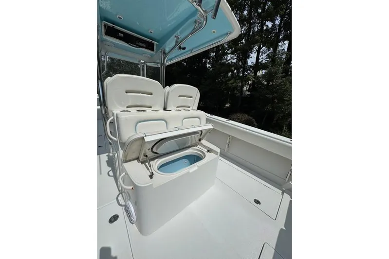  Yacht Photos Pics 2014 Jupiter 34 boat interior with seating and storage compartment open.