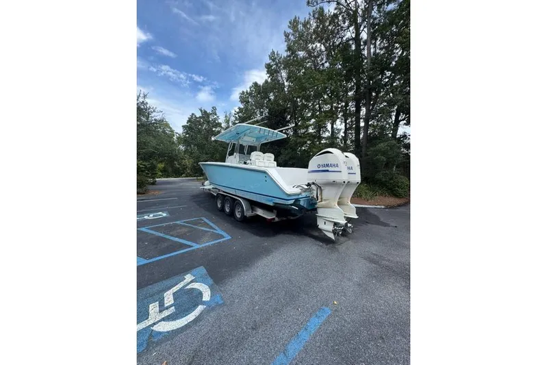  Yacht Photos Pics 2014 Jupiter 34 boat with Yamaha engines in a parking lot.
