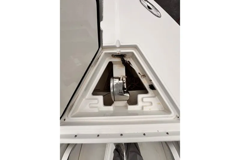  Yacht Photos Pics Anchor compartment of a 2014 Jupiter 34 boat, featuring a neatly stored anchor.