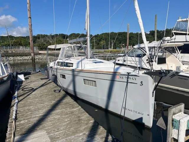 Nansea I Yacht Photos Pics 2017 Beneteau Oceanis 38.1 sailboat docked at a marina under clear skies.