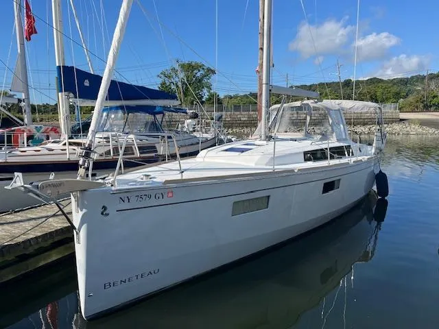 Nansea I Yacht Photos Pics 2017 Beneteau Oceanis 38.1 sailboat docked in a marina under clear skies.