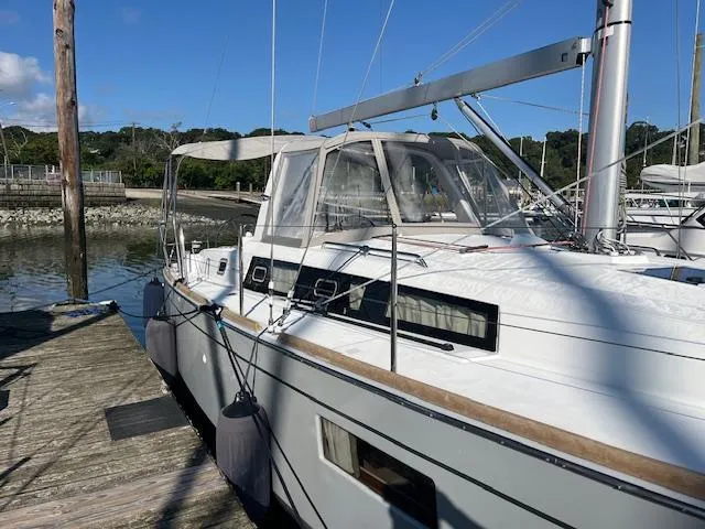 Nansea I Yacht Photos Pics Beneteau Oceanis 38.1 sailboat docked, 2017 model, sunny day, marina background.