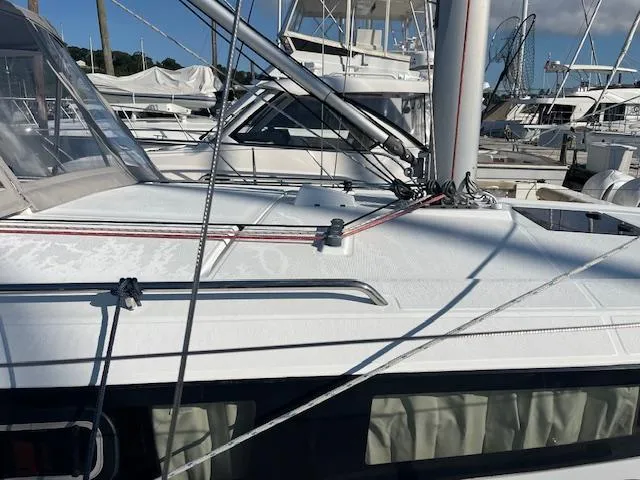 Nansea I Yacht Photos Pics 2017 Beneteau Oceanis 38.1 sailboat deck with rigging in a marina.