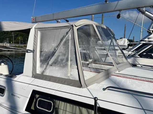 Nansea I Yacht Photos Pics 2017 Beneteau Oceanis 38.1 sailboat with cockpit enclosure, docked in marina.