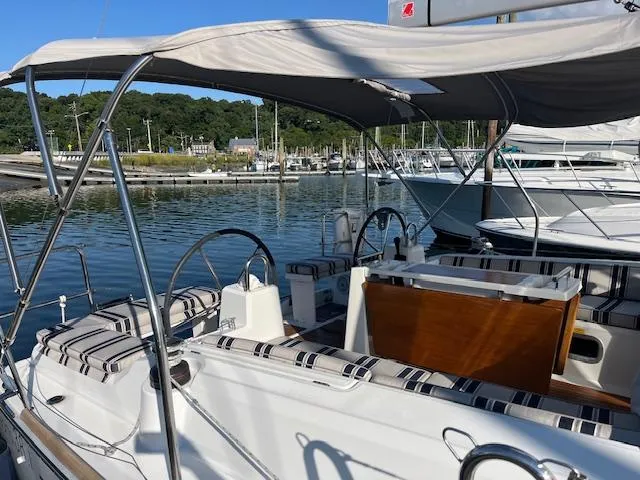 Nansea I Yacht Photos Pics Beneteau Oceanis 38.1 sailboat, 2017 model, docked in a marina with striped seating.