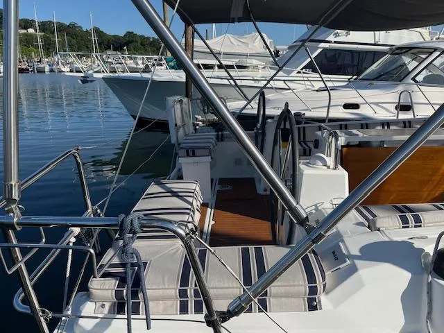 Nansea I Yacht Photos Pics 2017 Beneteau Oceanis 38.1 sailboat docked at marina, featuring spacious deck and seating.