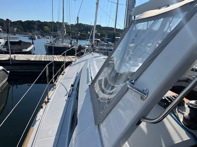 Nansea I Yacht Photos Pics 2017 Beneteau Oceanis 38.1 sailboat docked at a marina, side deck view.