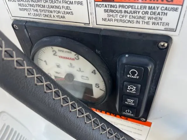 Nansea I Yacht Photos Pics Control panel of a 2017 Beneteau Oceanis 38.1 sailboat with warning labels.