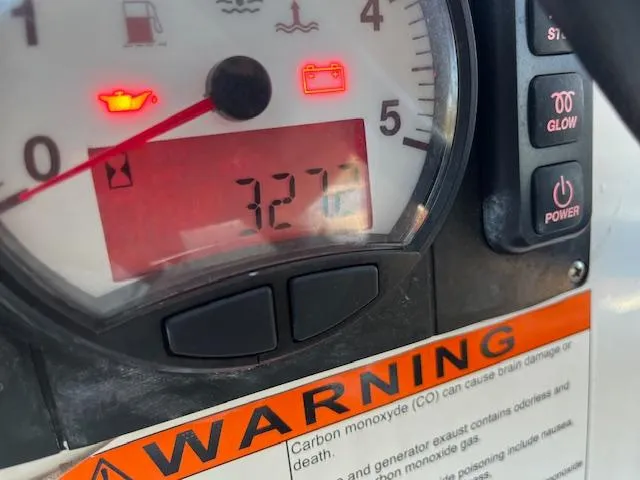 Nansea I Yacht Photos Pics Close-up of Beneteau Oceanis 38.1 2017 engine gauge displaying 327 hours with warning label.