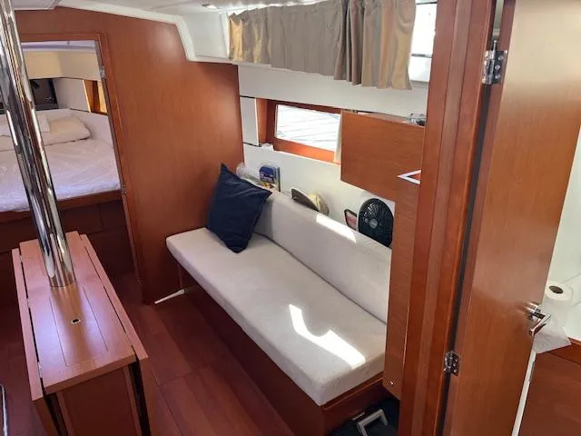 Nansea I Yacht Photos Pics 2017 Beneteau Oceanis 38.1 interior with cozy seating and wooden finishes.