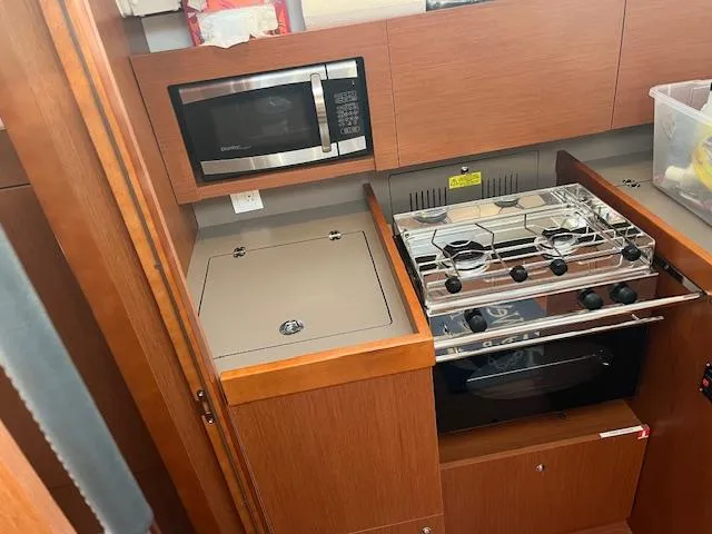 Nansea I Yacht Photos Pics Galley kitchen in 2017 Beneteau Oceanis 38.1 yacht with stove and microwave.