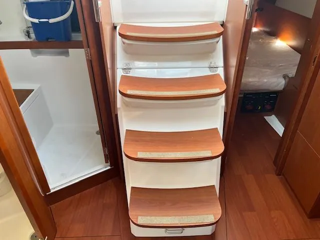 Nansea I Yacht Photos Pics Interior of 2017 Beneteau Oceanis 38.1 yacht, featuring wooden steps and cabin access.